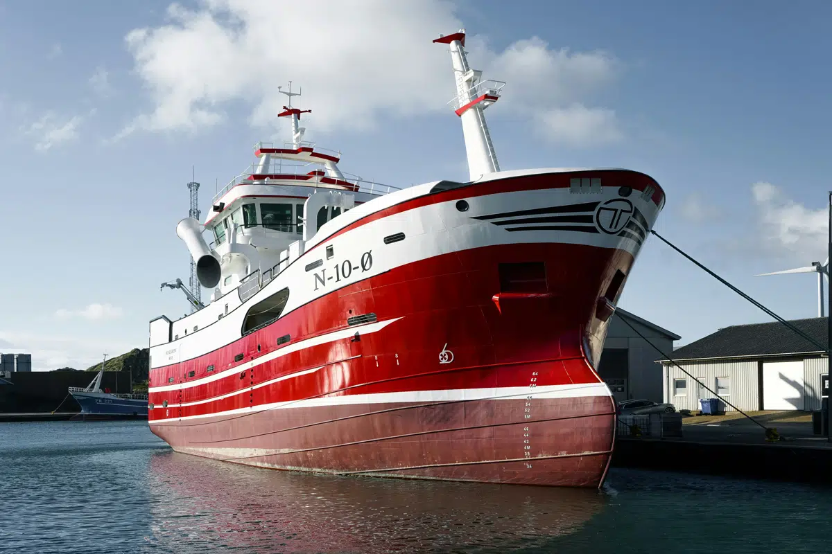 Red and white Canadian fishing vessel at the dock
